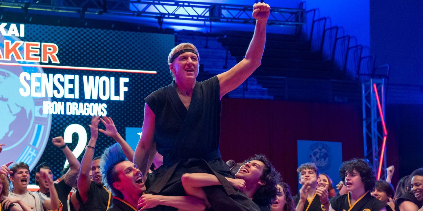 Jacob Bertrand and Xolo Mariduena as Hawk and Miguel hoisting a triumphant William Zabka as Johnny, up in the Cobra Kai finale.