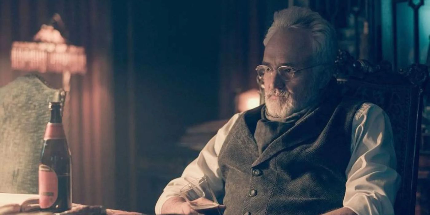 Bradley Whitford as Joseph Lawrence sitting in a chair in The Handmaid&rsquo;s Tale.