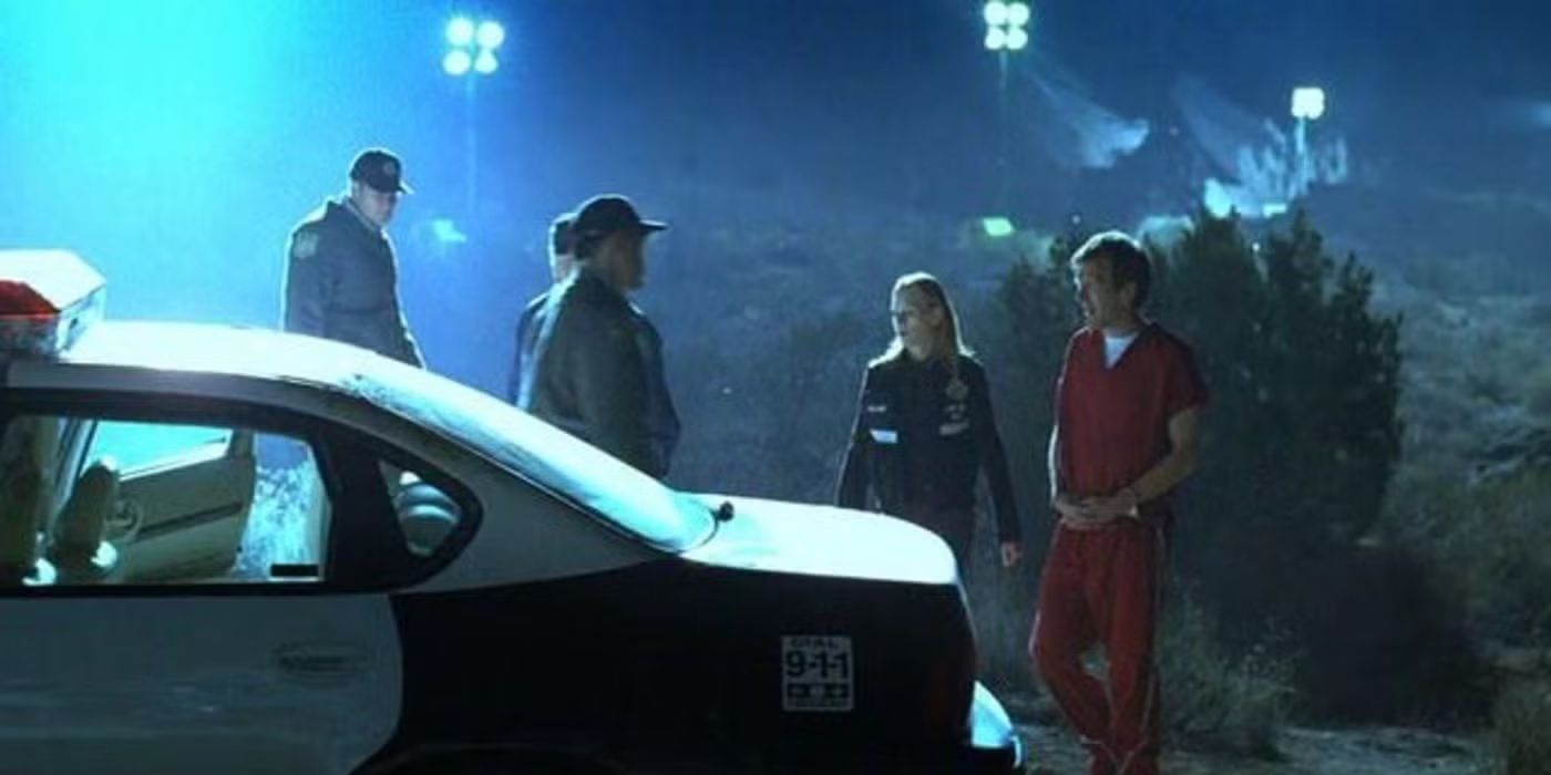 Officers escort a man who is handcuffed and wearing a prison uniform outside in CSI episode After the Show.