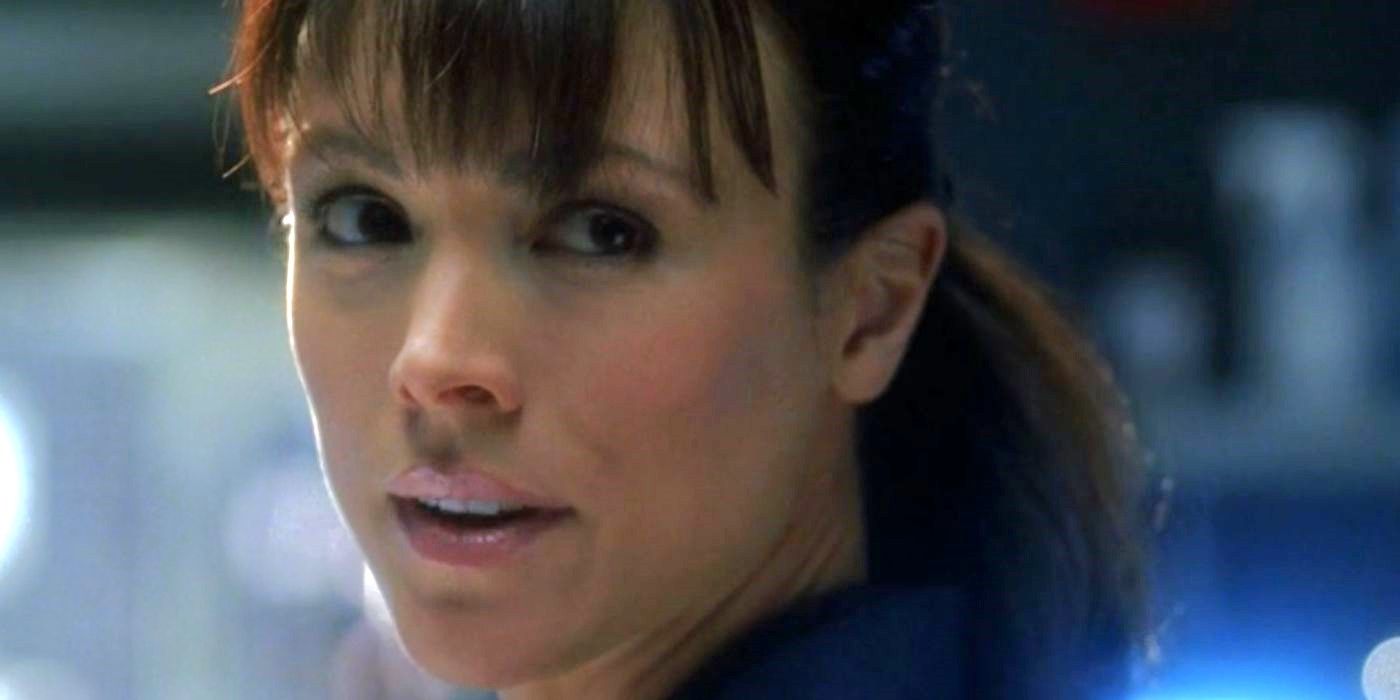 A CSI agent looks behind her at something off-camera in CSI episode The Theory of Everything.
