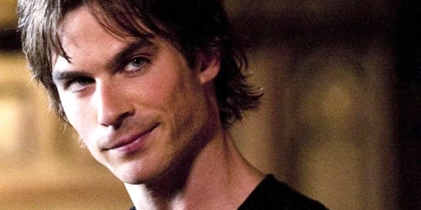 Damon Salvatore gives a sly smile in The Vampire Diaries.
