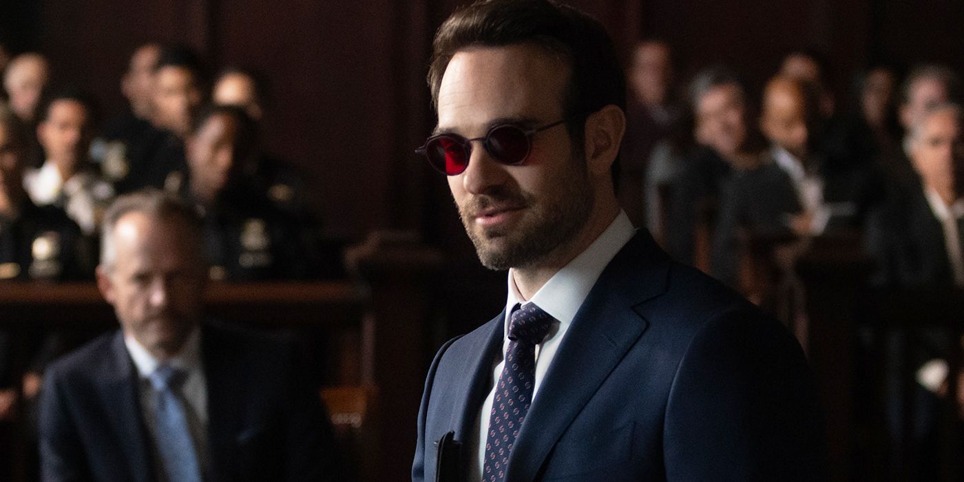 Charlie Cox as Matt Murdock in a suit and standing in the courtroom in 'Daredevil: Born Again'