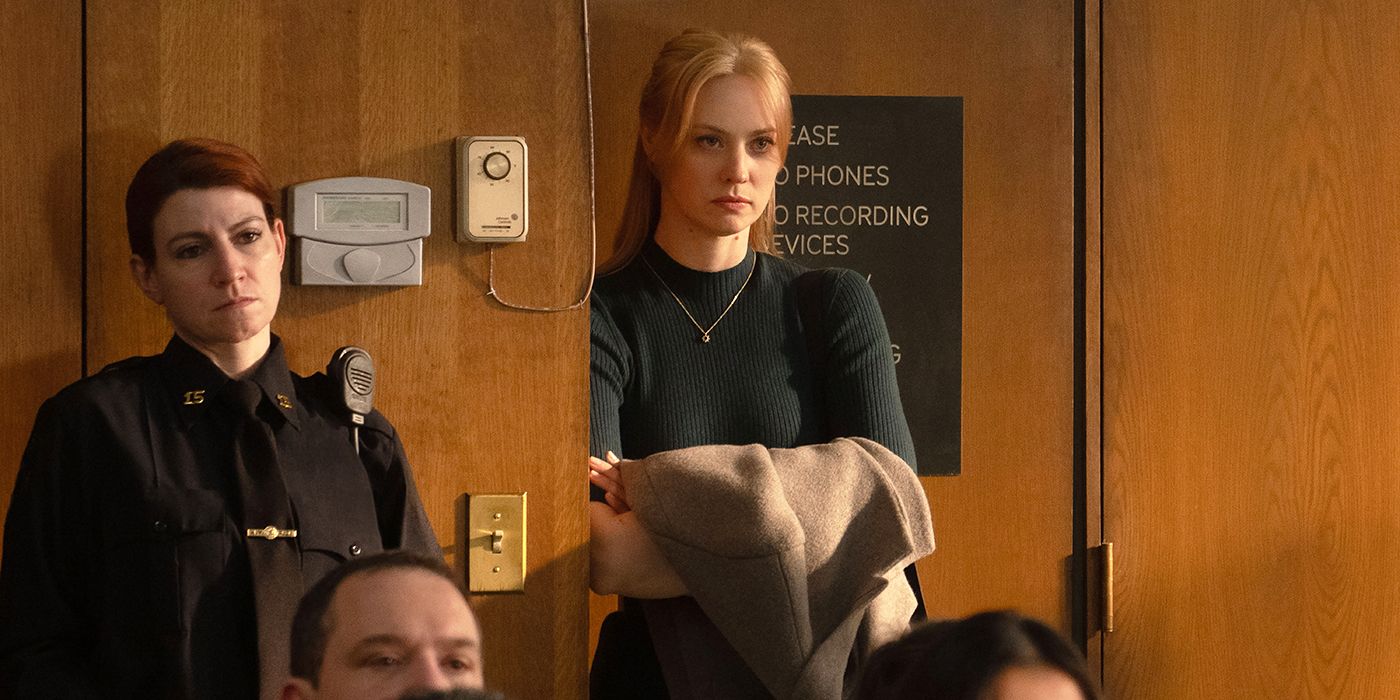 Deborah Ann Woll as Karen Page standing in a court room and leaning against the wall in Daredevil: Born Again