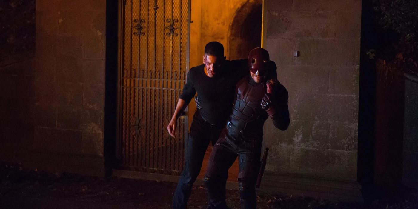Daredevil carrying the Punisher away from a building in Daredevil