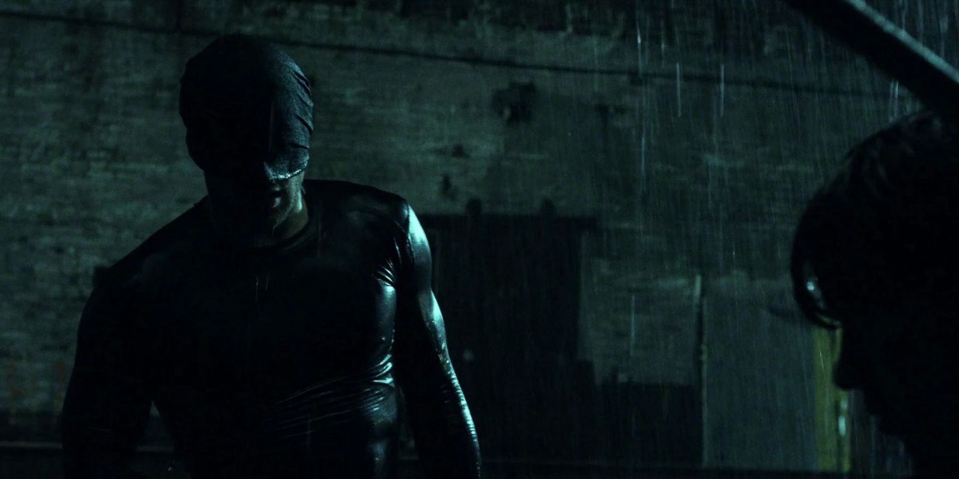 Daredevil looking at someone in the rain in Daredevil Season 1, Episode 1