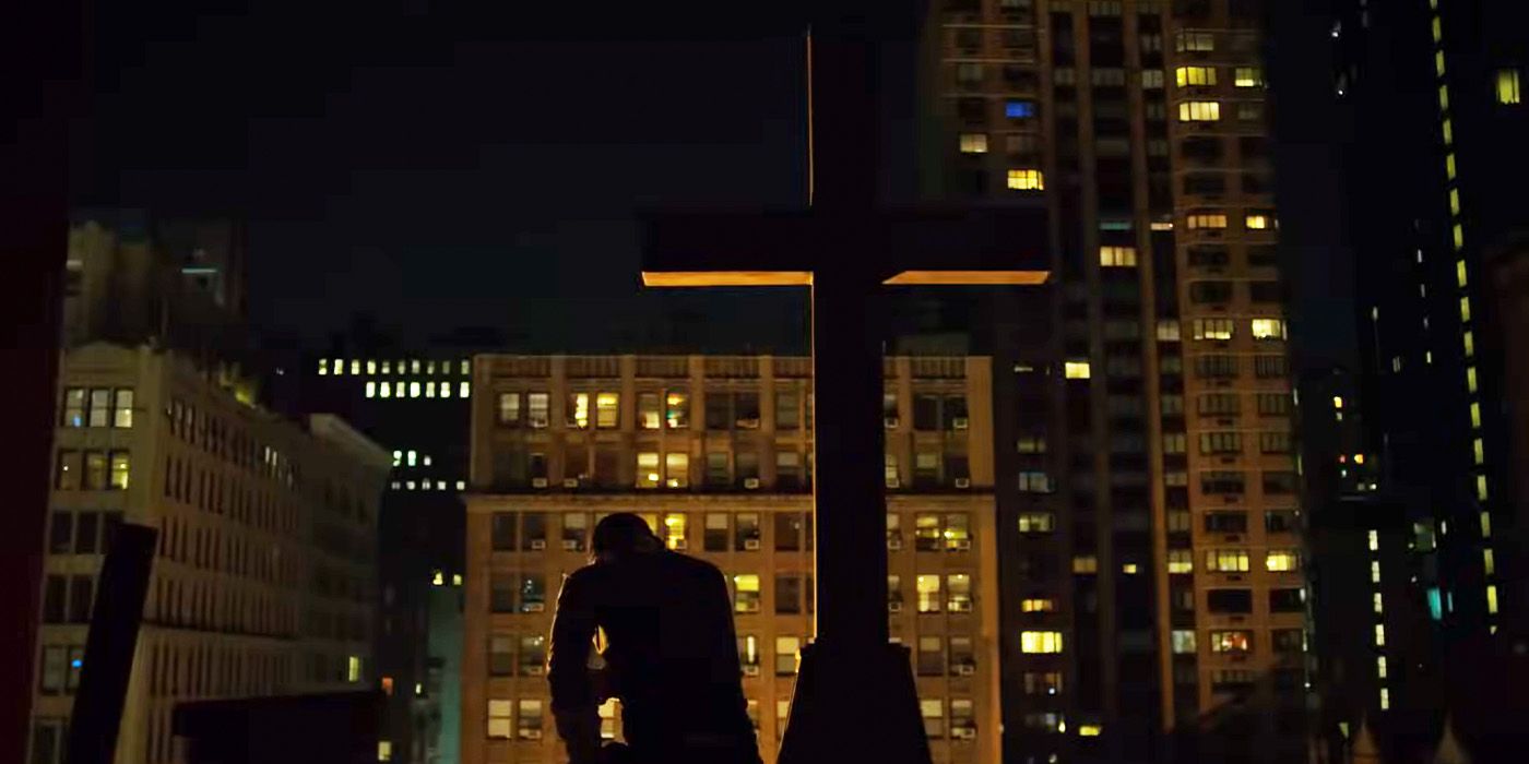 Matt Murdock/Daredevil (Charlie Cox) rests on a rooftop beside a giant cross on &lsquo;Daredevil&rsquo;