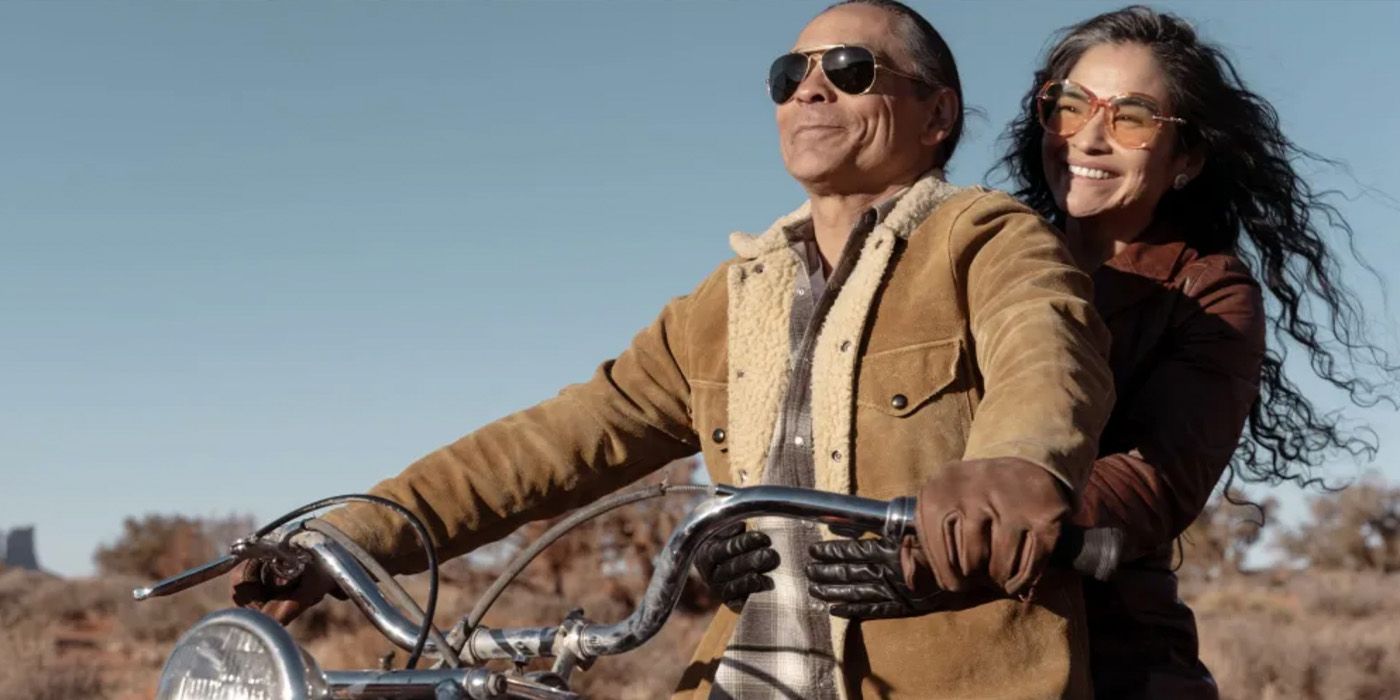 Joe Leaphorn (Zahn McClarnon) and Emma Leaphorn (Deanna Allison) on a motorcycle in &lsquo;Dark Winds&rsquo;