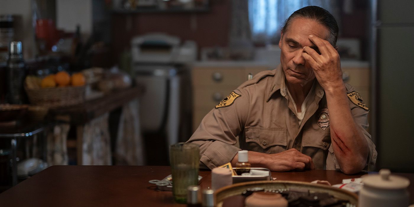 Joe Leaphorn (Zahn McClarnon) sits depressed at the kitchen table on 'Dark Winds'