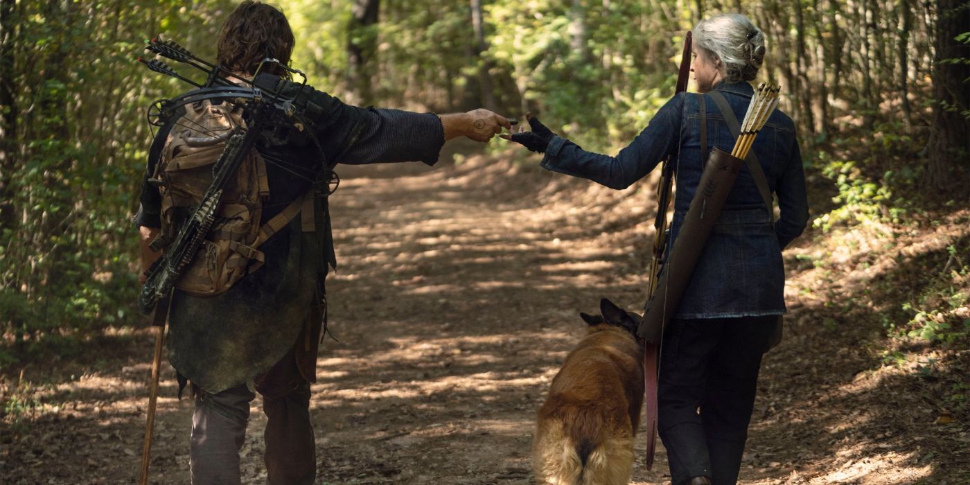 Norman Reedus as Daryl walking with Melissa McBride as Carol and a dog in The Walking Dead episode Diverged.