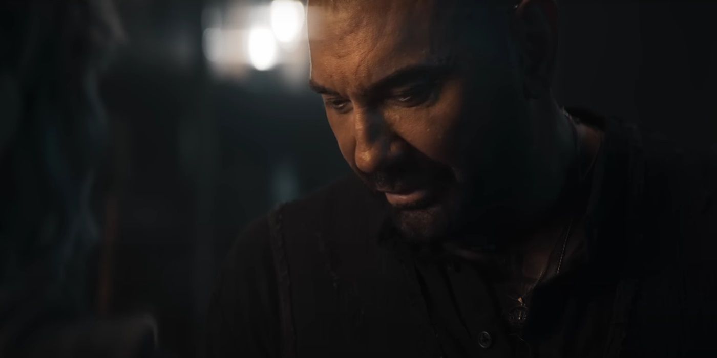 Dave Bautista, looking at something, as Boyce in In the Lost Lands