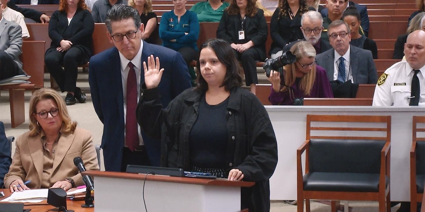 A woman raising her right hand in a trial in Death by Numbers