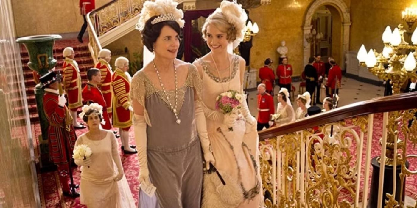 Elizabeth Lee McGovern and Lily James walking upstairs in fancy gowns in Downton Abbey Season 4, Episode 9.