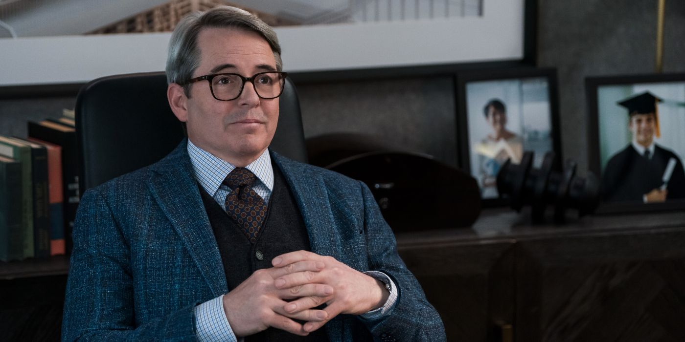 Matthew Broderick sitting at a desk