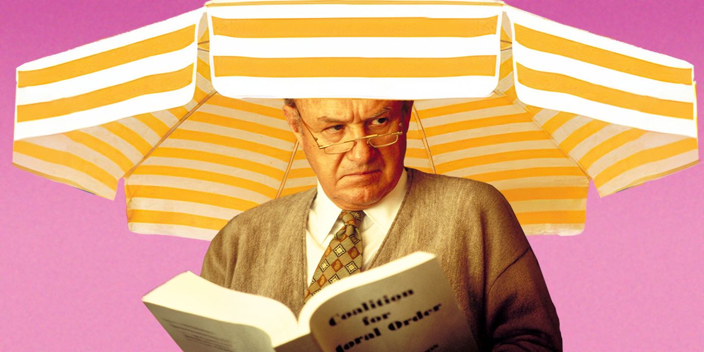 Actor Gene Hackman as Senator Kevin Keeley in The Birdcage, sat under a yellow parasol and holding a book called Coalition for Moral Order.