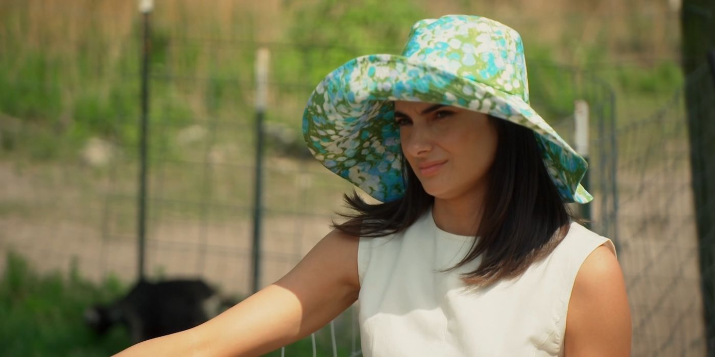 Paige DeSorbo looking irritated wearing a floral hat on &lsquo;Southern Charm&rsquo;.