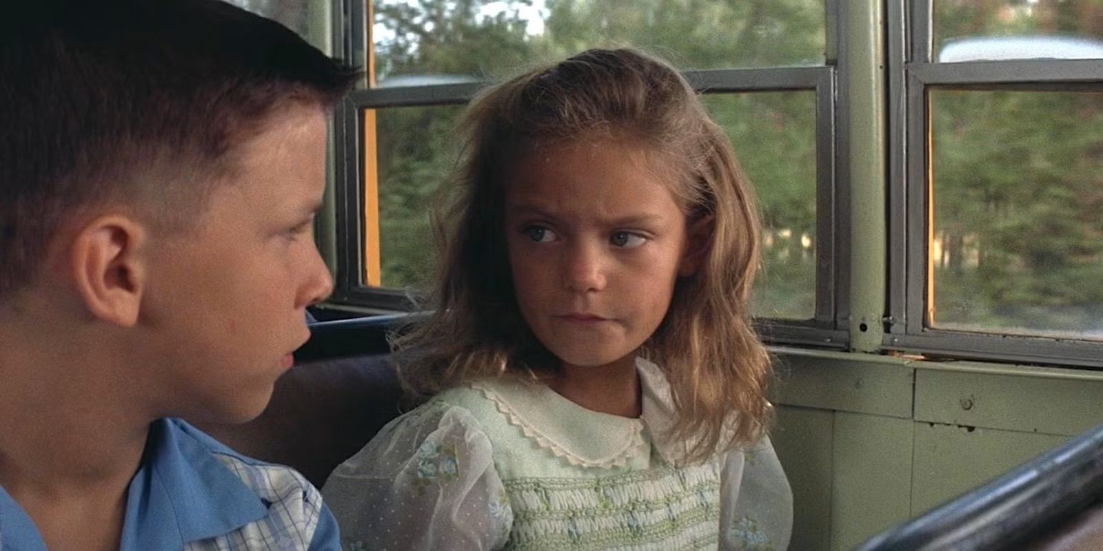 Young Forrest Gump and Jenny sit together on the bus