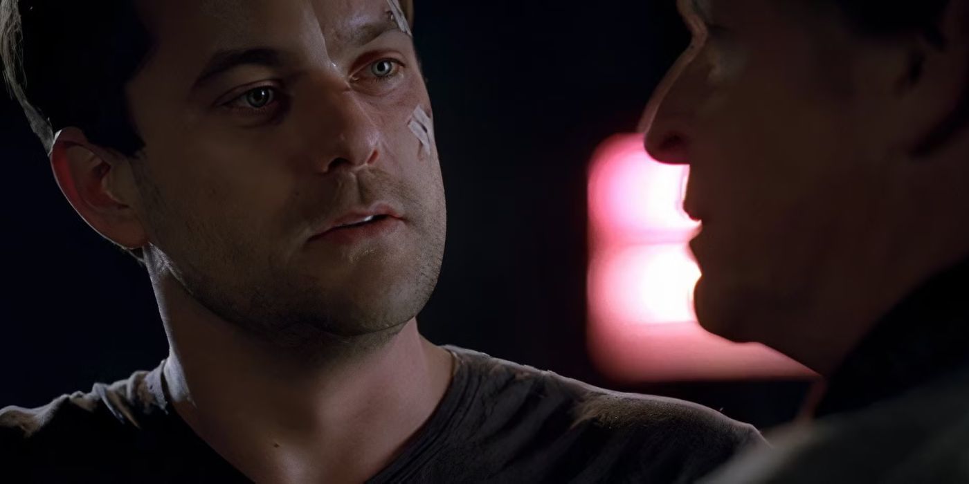 Peter Bishop with small cuts on his face speaking to his father Walter Bishop in the Fringe Season 3 finale. 