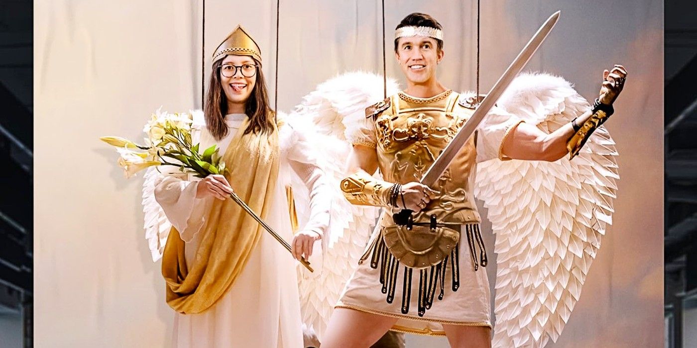 Poppy Li and Ian Grimm dressed as angels and floating in the air in Mythic Quest Season 4