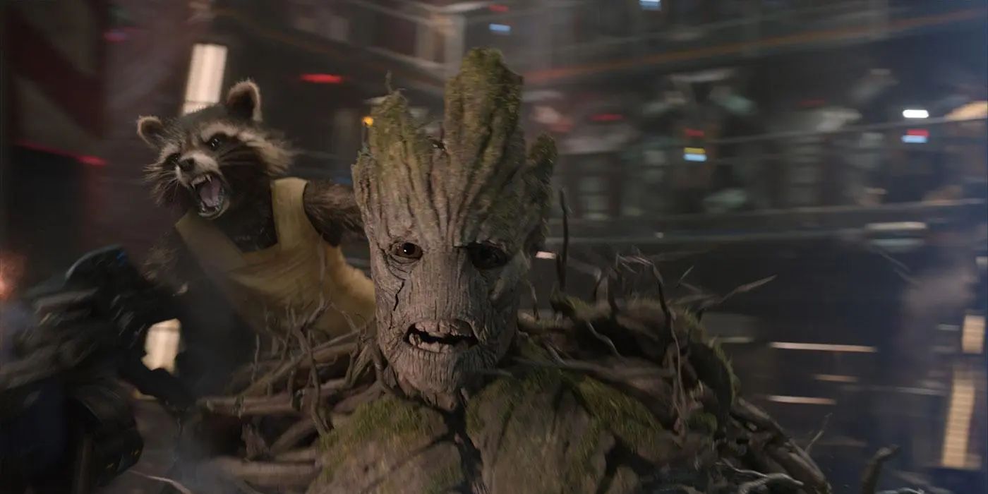 Rocket (Bradley Cooper) on Groot (Vin Diesel) shoulder as they both yell in Guardians of the Galaxy, 2014.