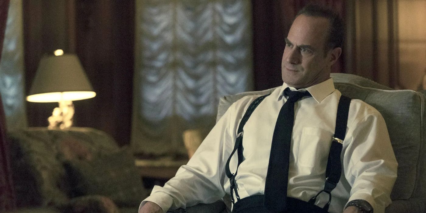 Christopher Meloni  as Commander George Winslow sitting in a chair in The Handmaid&rsquo;s Tale.