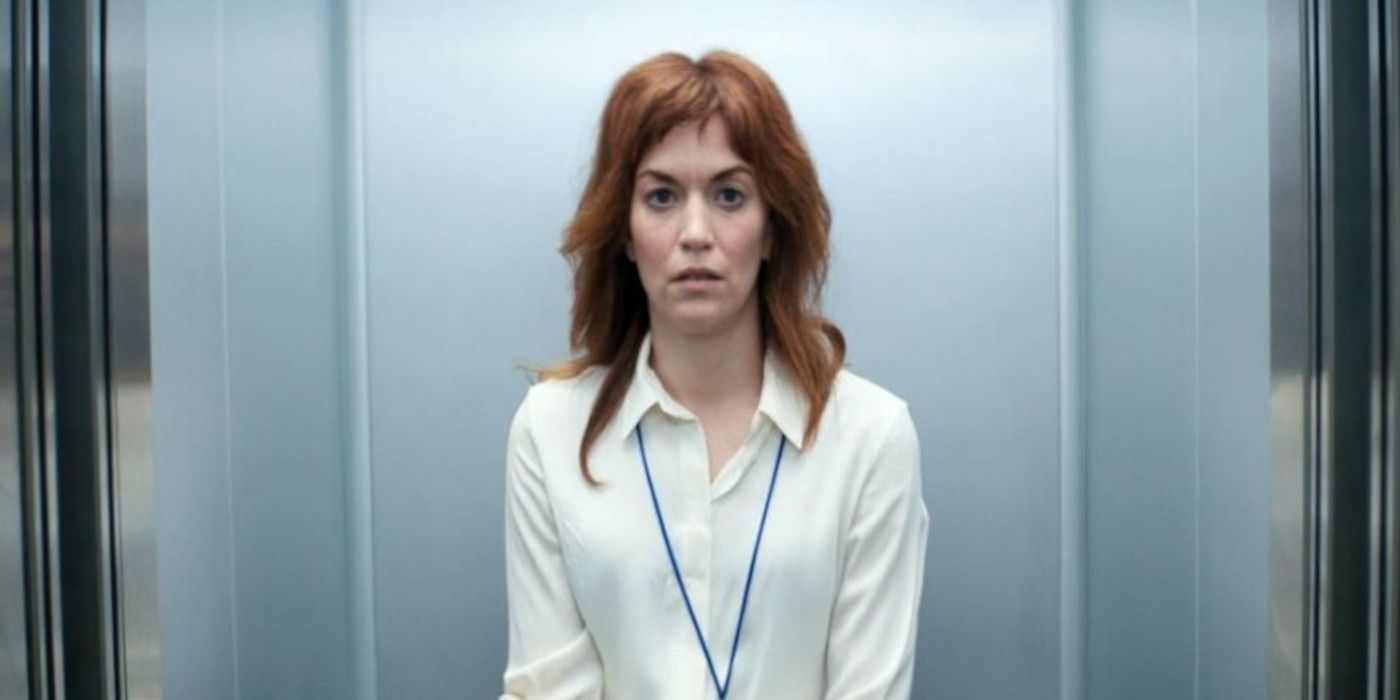 Helly looks disheveled in the elevator in Severance.