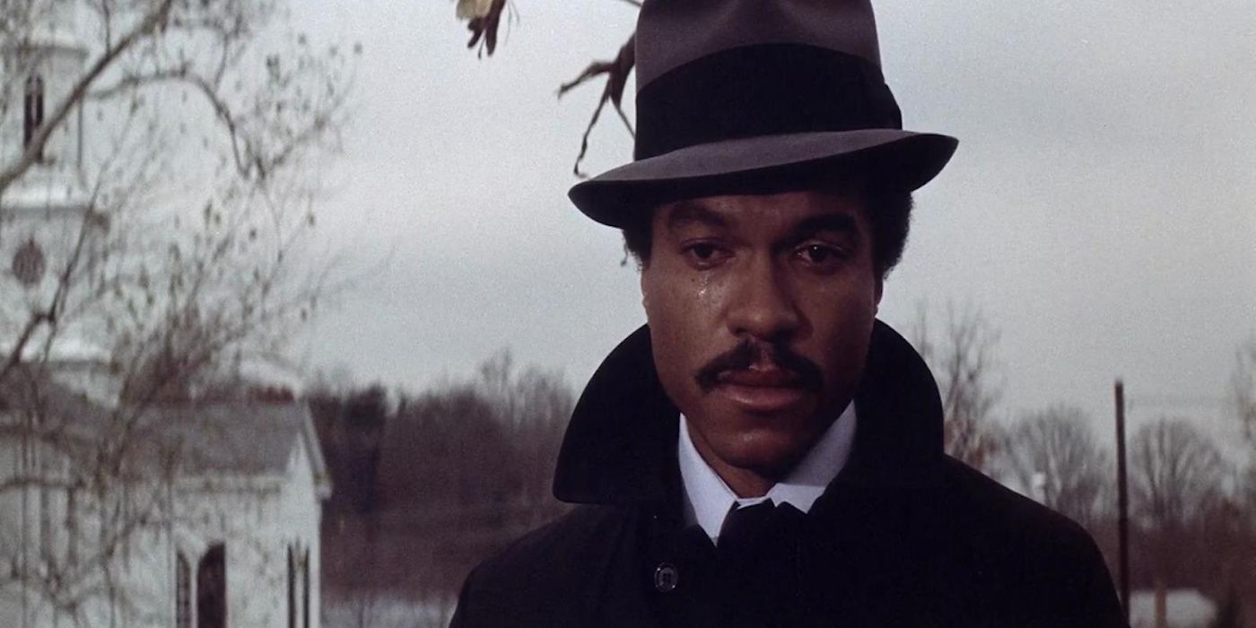 Billy Dee Williams as Nick Allen crying at a cemetery in Hit!