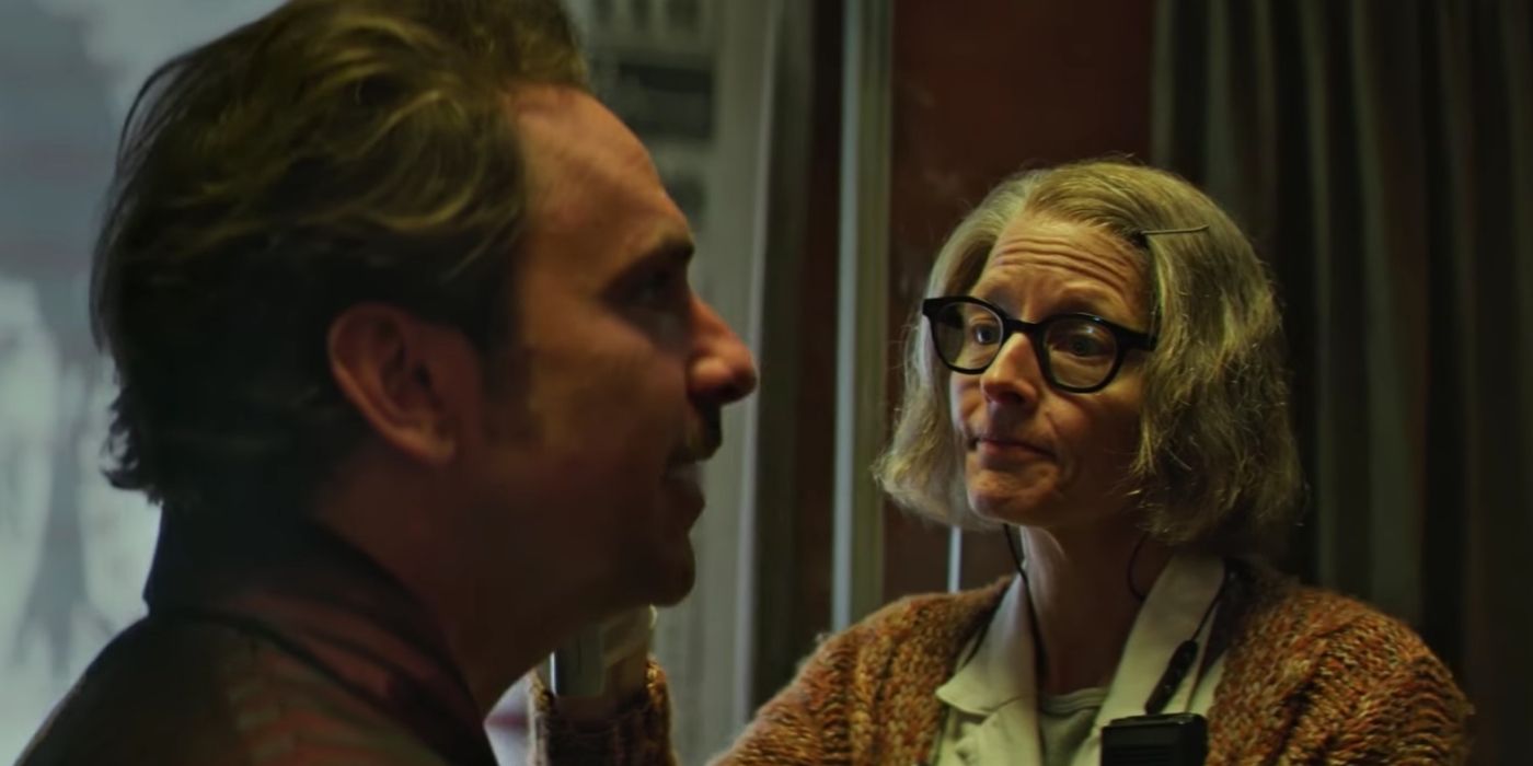 The Nurse (Jodie Foster) examines Acapulco (Charlie Day) in Hotel Artemis​​​​​​.
