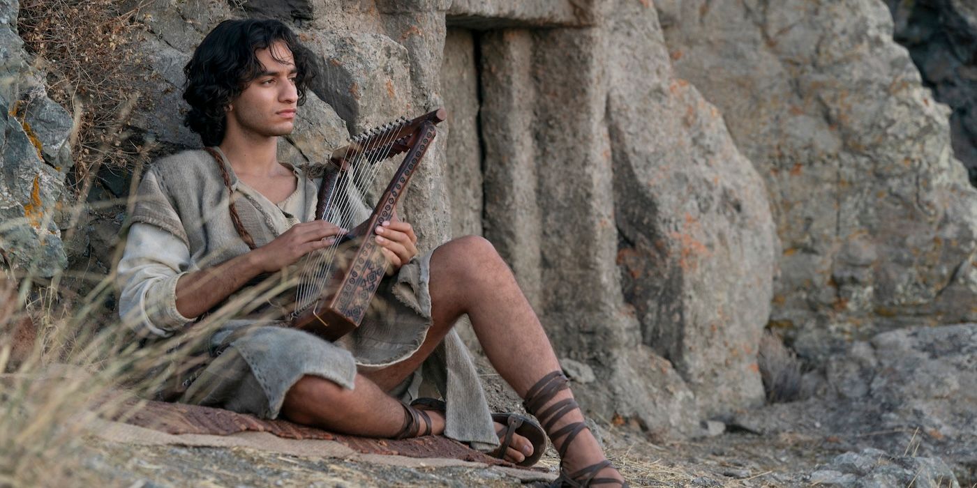 David (Michael Iskander) sits with his lyre beside the rocks on 'House of David'