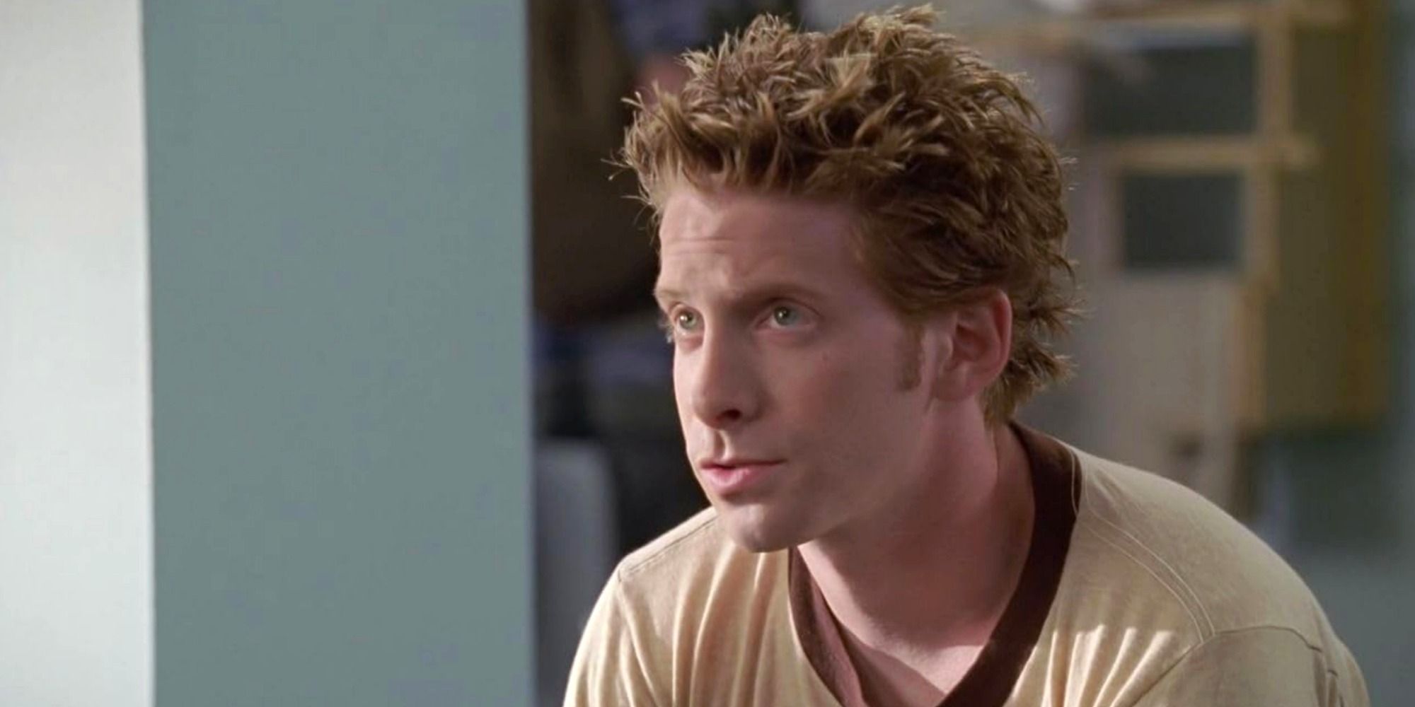 Oz, played by Seth Green, looks to someone off-screen in Buffy the Vampire Slayer.