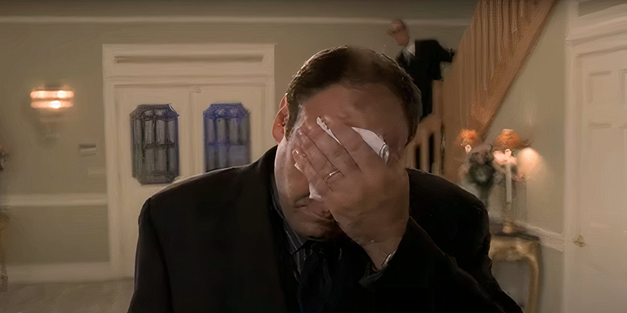 James Gandolfini as Tony Soprano wiping his forehead with a cloth in The Sopranos.