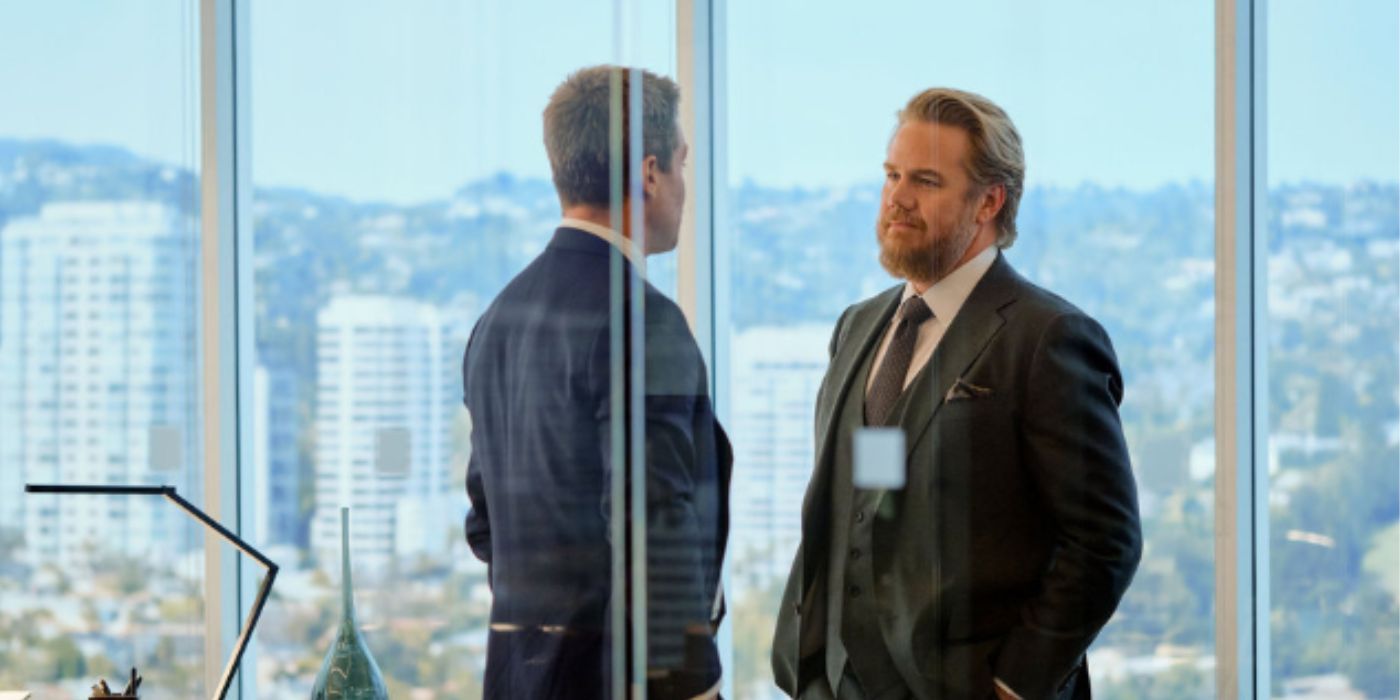 Josh McDermitt speaking with Stephen Amell in 'Suits LA'.