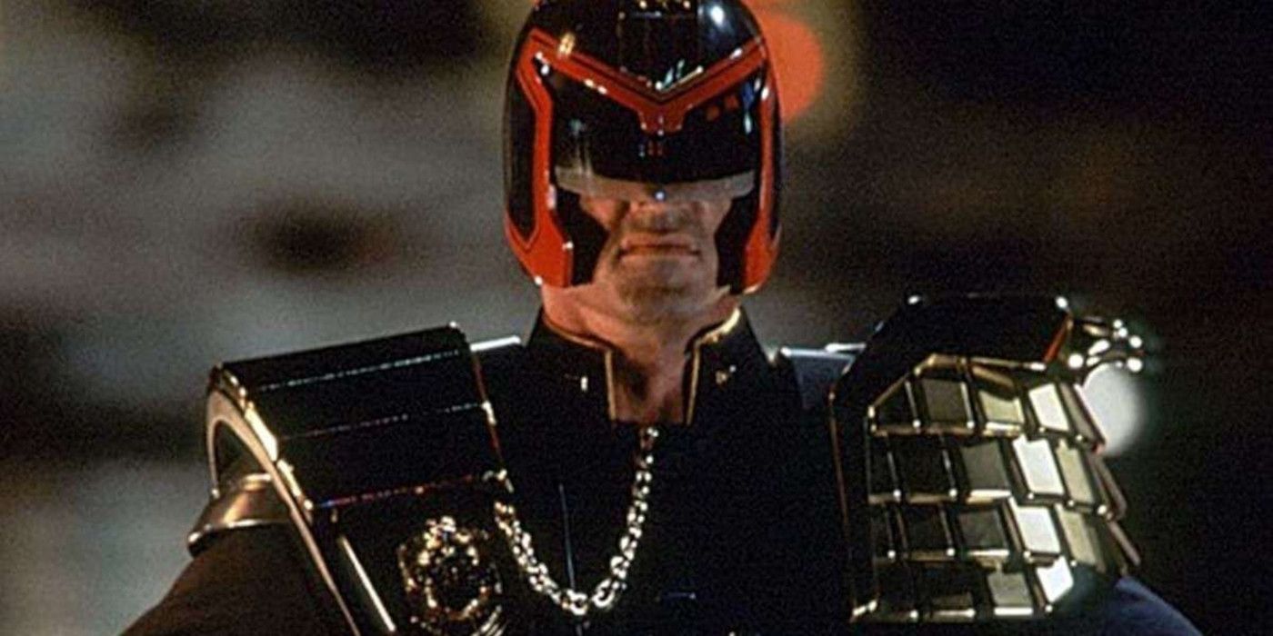 Sylvester Stallone as Judge Dredd smirking in Judge Dredd.
