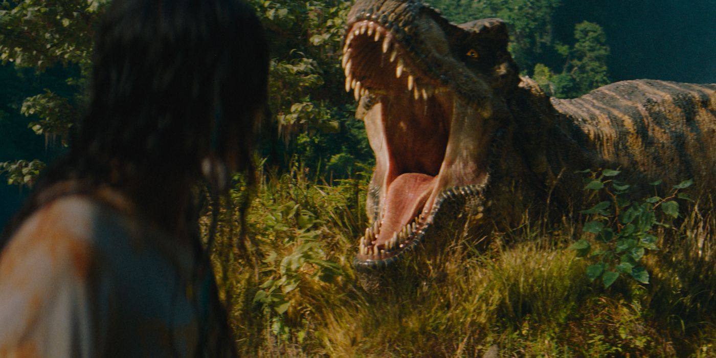 A T-Rex roaring and charging Luna Blaise in Jurassic World Rebirth.