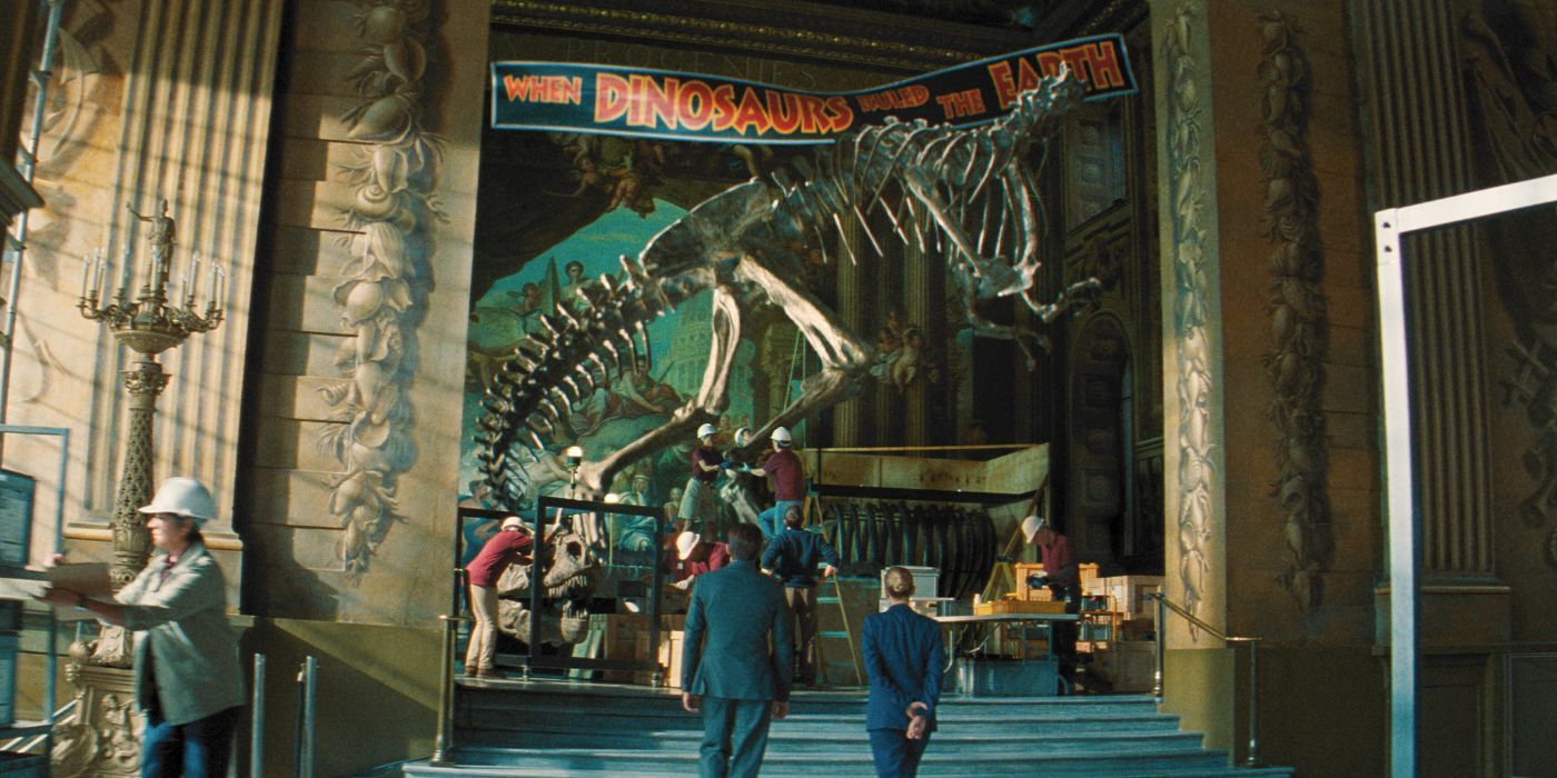 Scarlett Johansson and Rupert Friend facing a T-Rex fossil in a museum in Jurassic World Rebirth.