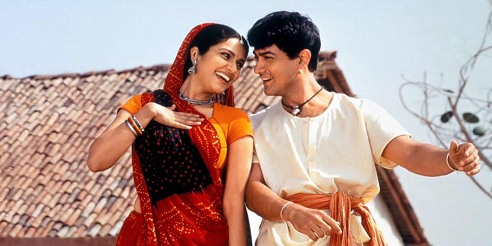 aamir khan and gracy singh dancing and looking at each other from lagaan.