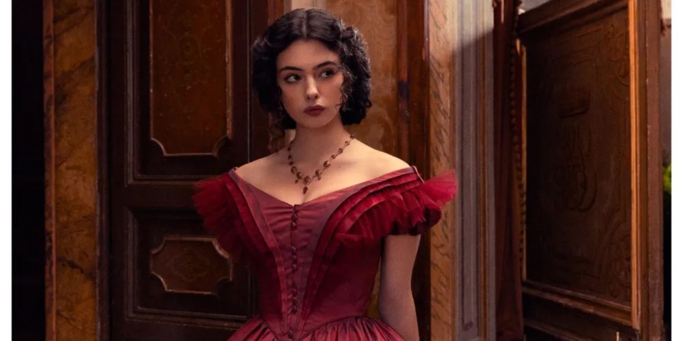 Deva Cassel wears a gorgeous, frilly, puffy red dress