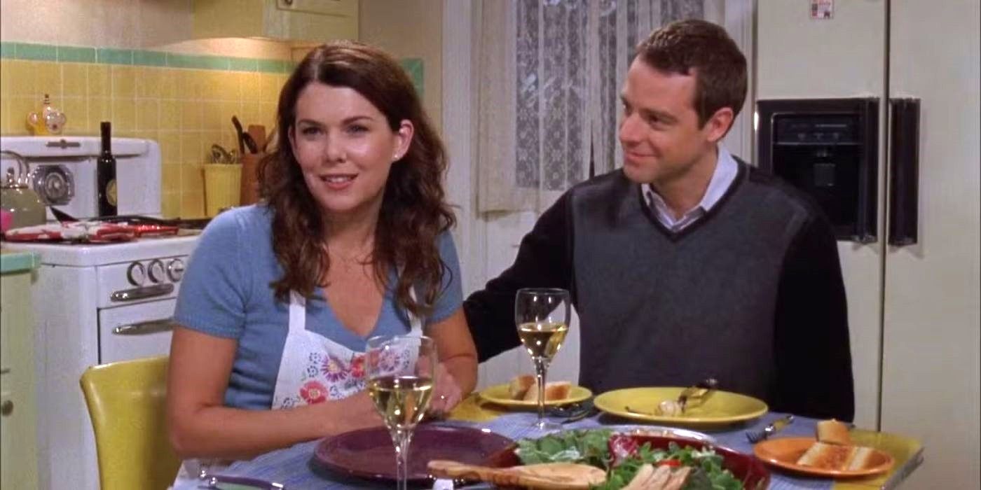 Lorelai and Christopher share a meal at a kitchen table in Season 7, Episode 8 of Gilmore Girls.