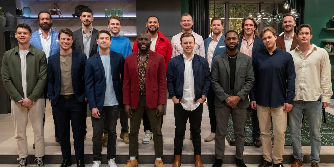 The men of 'Love Is Blind' Season 8 stand in two rows smiling for the camera