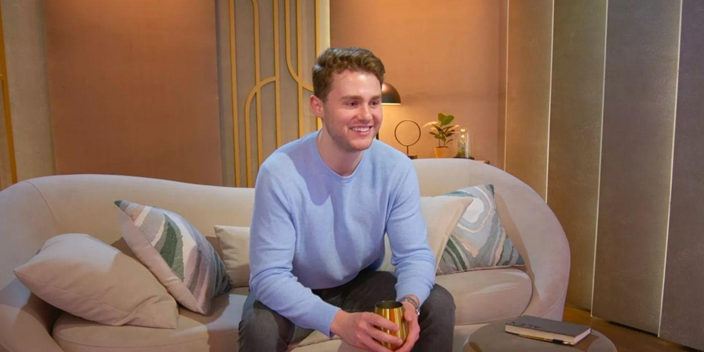 Alex Brown sits on the couch in the pods in 'Love Is Blind' season 8