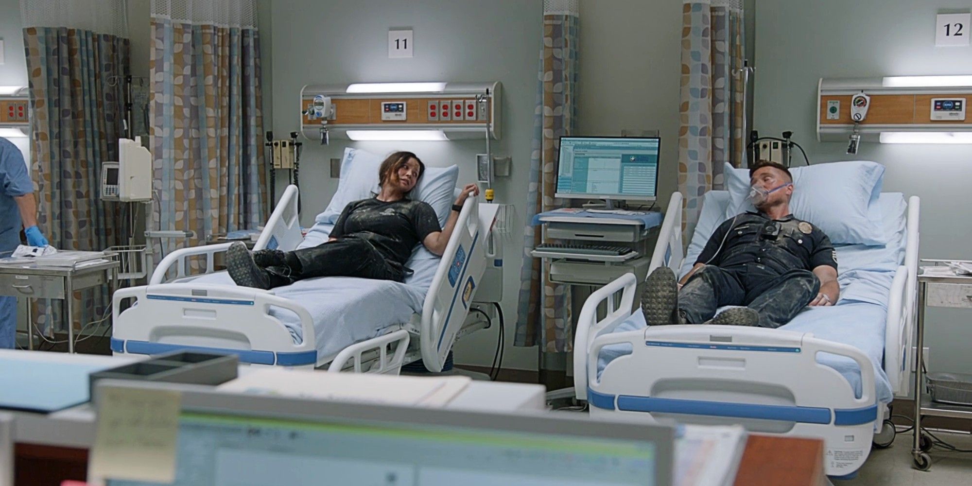 Lucy Chen and Tim Bradford lying in hospital beds next to each other in The Rookie Season 7