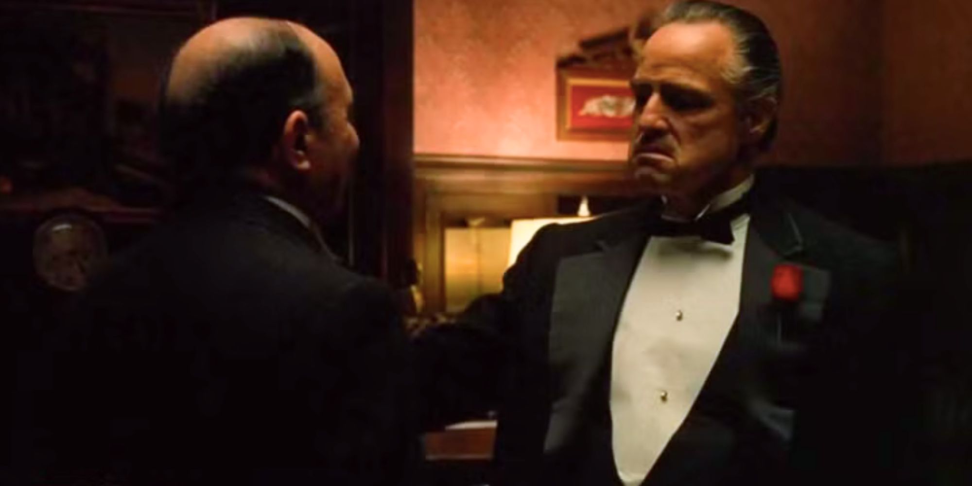 Marlon Brando standing in front of Salvatore Corsitto with hand on his shoulder in The Godfather (1972)