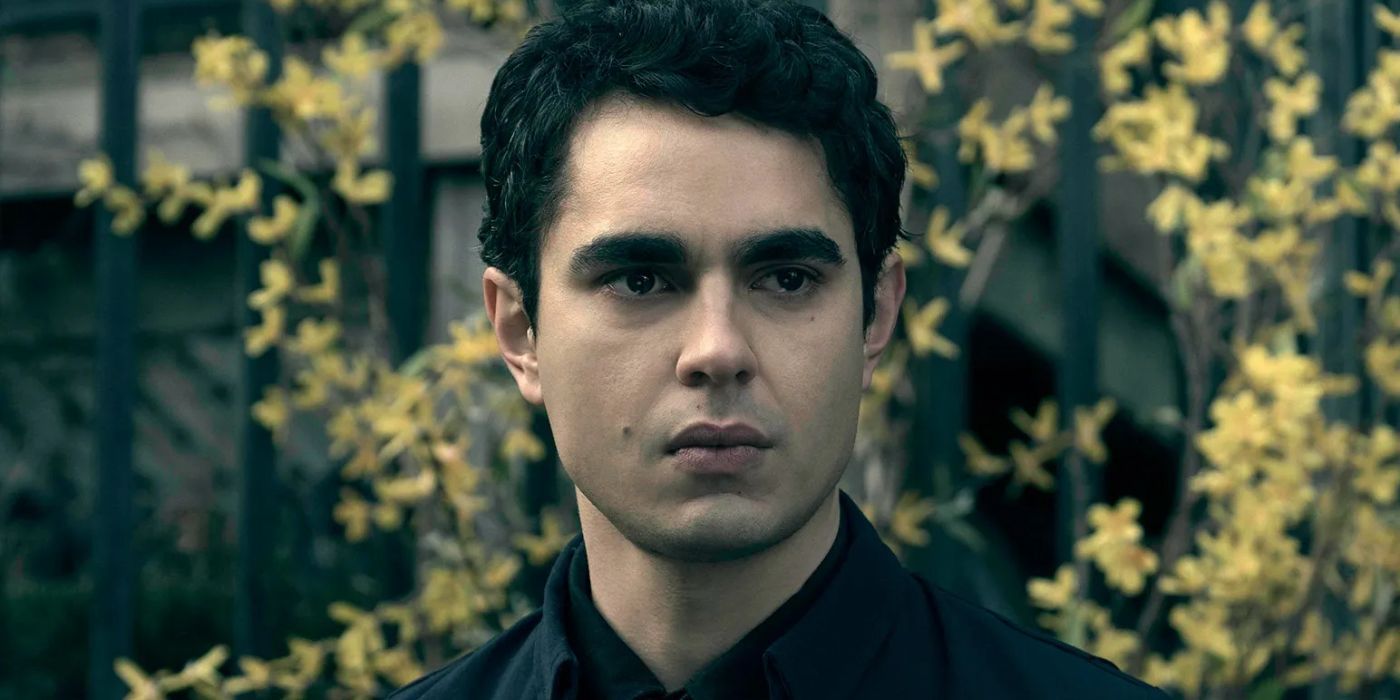 Max Minghella as Nick up close with flowers in The Handmaid&rsquo;s Tale.
