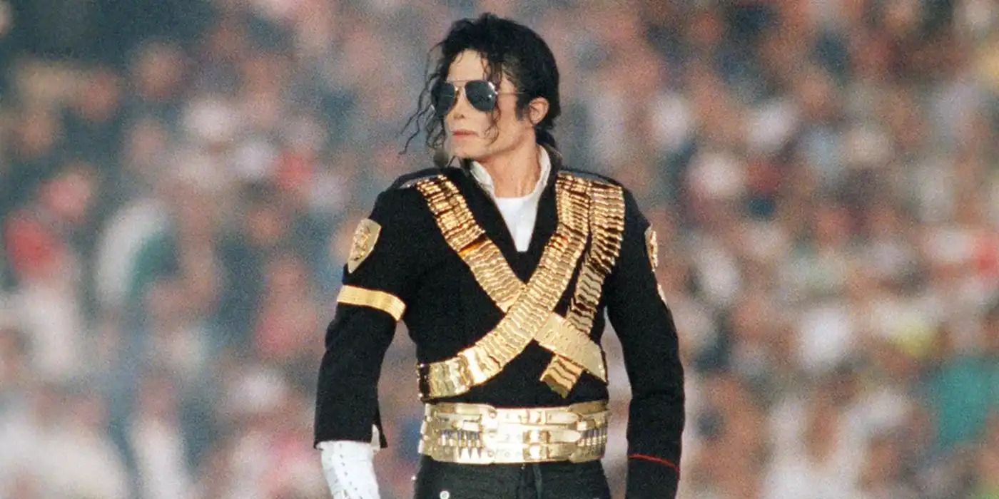 Michael Jackson in a jacket and sunglasses looking to the left at the 1993 Super Bowl