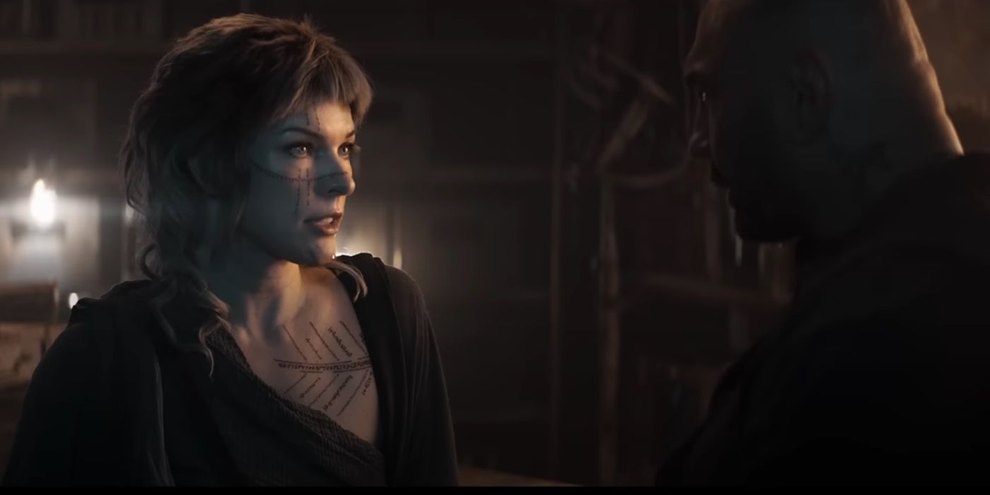 Milla Jovovich, looking at Boyce, as Gray Alys in In the Lost Lands