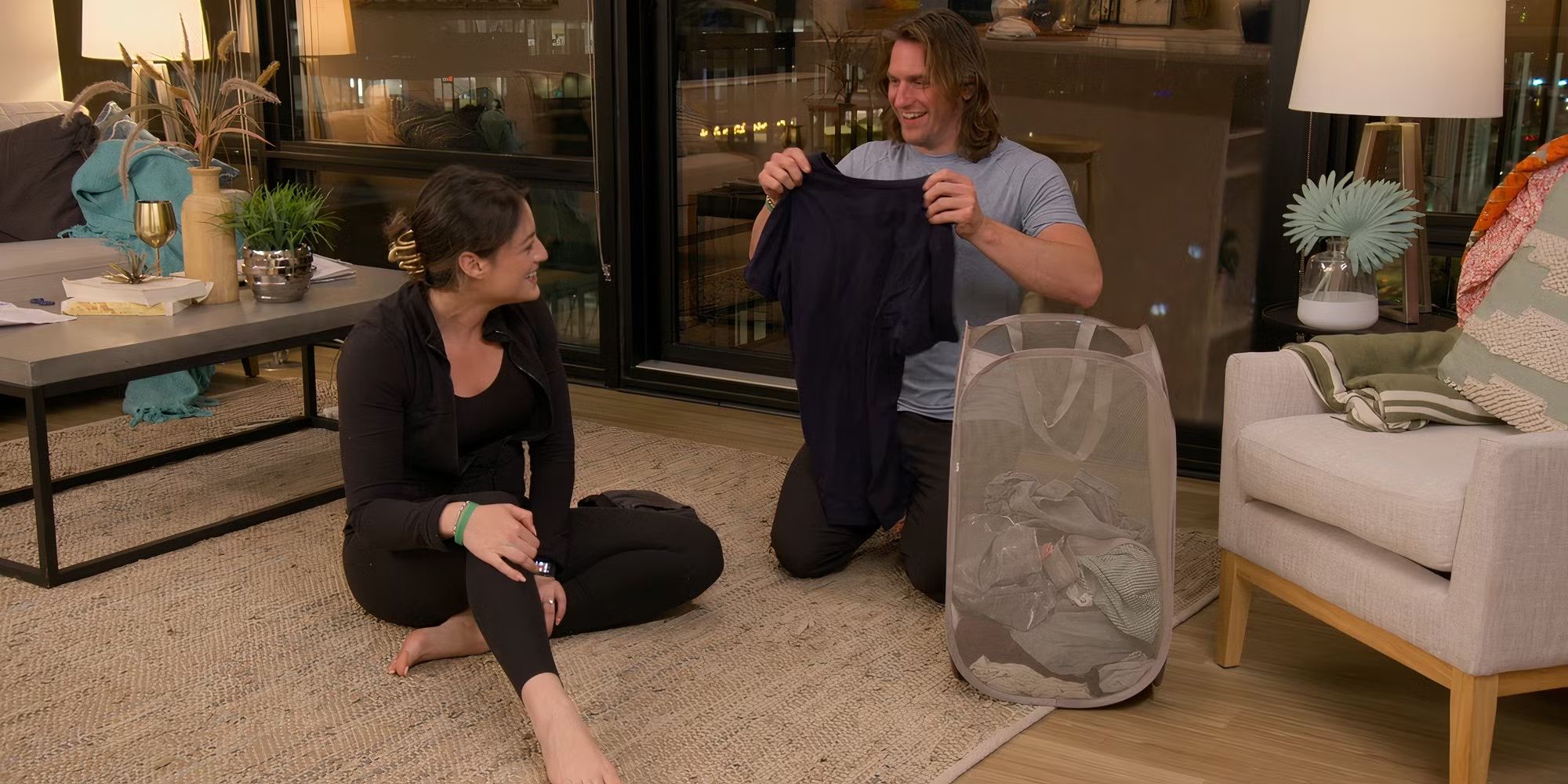 ​​​​​​​​​​​​​​​​​​​​​​​​​​​​Monica Danús and Joey Leveille folding laundry in Love Is Blind Season 8