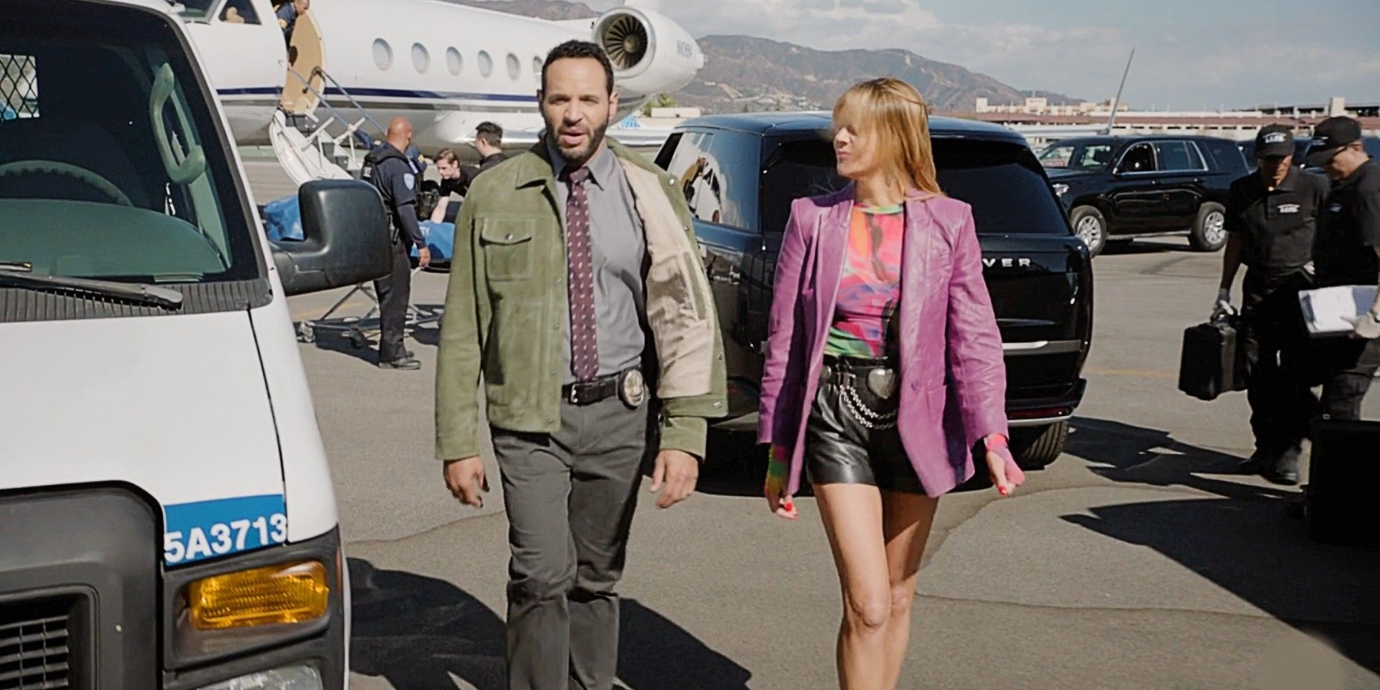 Morgan and Karadec walking next to each other on a tarmac in High Potential Season 1 Episode 12