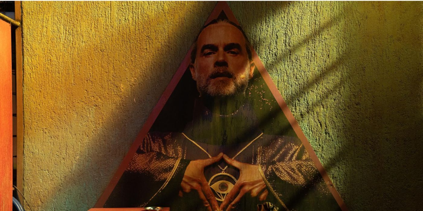 Murray Bartlett making an inverted triangle hand gesture in &lsquo;O&rsquo;Dessa&rsquo;.