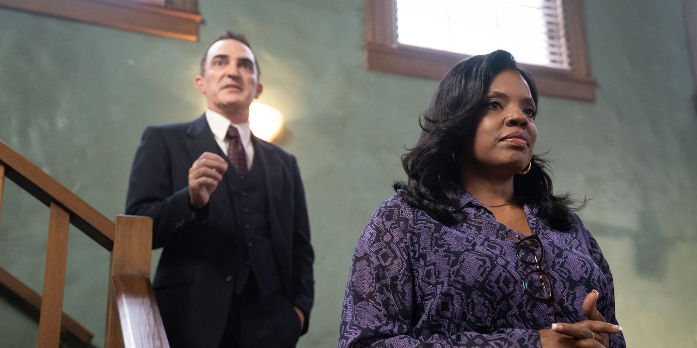 Cliff Wheeler (Patrick Fischler) gives a speech while Mary-Jo Hayes (Tyla Abercrumbie) listens in NCIS: Origins