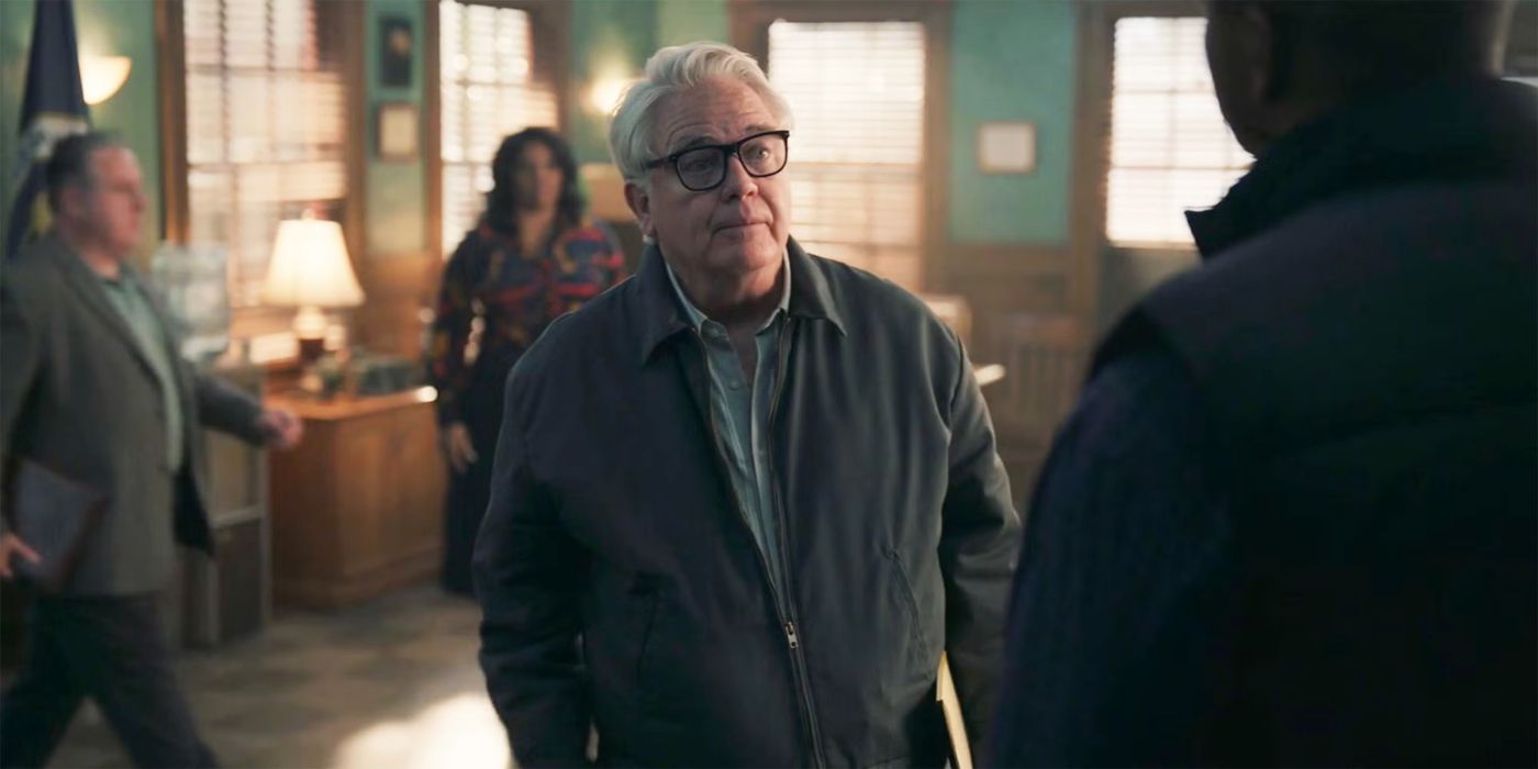 Richard Kowalski (Michael Harney) standing in the center of the NIS office in NCIS: Origins
