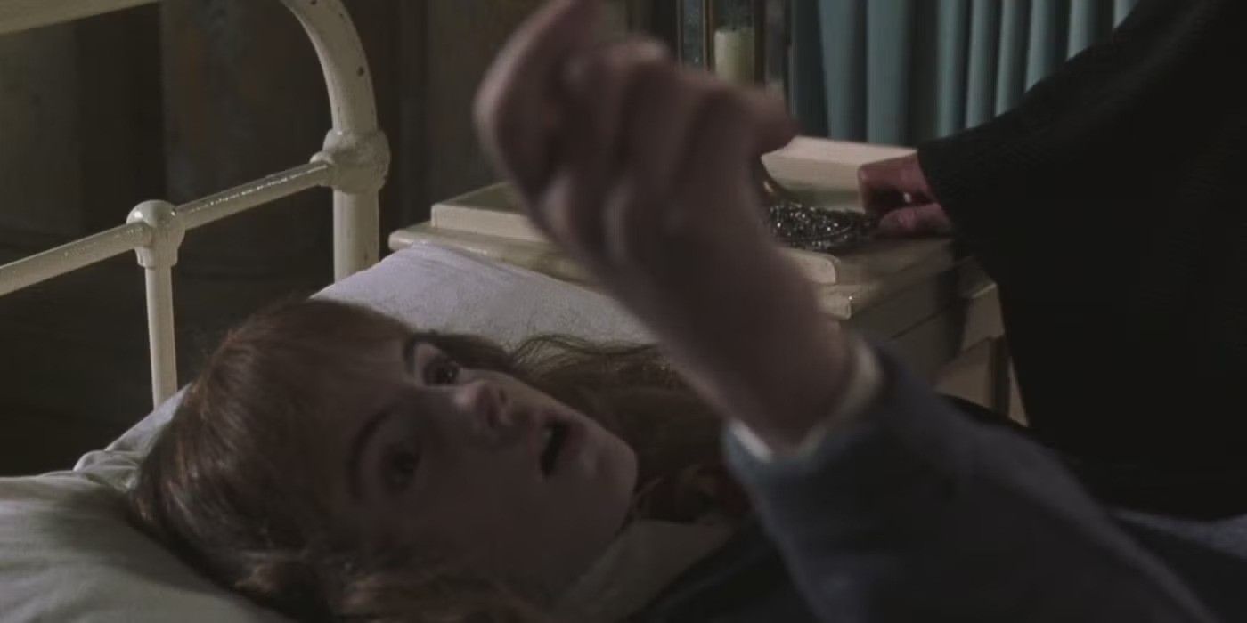 Hermione in a suspended state lying on a bed in Harry Potter and the Chamber of Secrets.